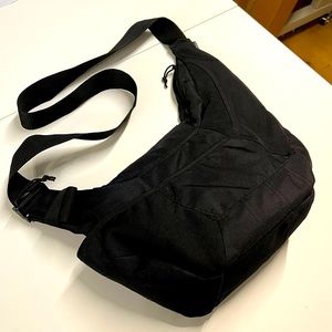 Sling style camera bag